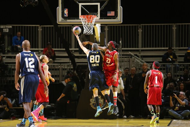 NEW ORLEANS, LA - FEBRUARY 14: U.S. Secretary of Education Arne Duncan of the East Team shoots against Rapper Snoop Dogg of the West Team during the Sprint NBA All-Star Celebrity Game at Sprint Arena during the 2014 NBA All-Star Jam Session at the Ernest N. Morial Convention Center on February 14, 2014 in New Orleans, Louisiana. NOTE TO USER: User expressly acknowledges and agrees that, by downloading and/or using this photograph, user is consenting to the terms and conditions of the Getty Images License Agreement.  Mandatory Copyright Notice: Copyright 2014 NBAE (Photo by Joe Murphy/NBAE via Getty Images)