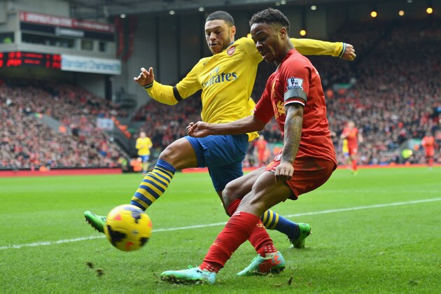 LIVERPOOL, ENGLAND - FEBRUARY 08:  Raheem Sterling of Liverpool is challenged by Alex Oxlade-Chamberlain of Arsenal during the Barclays Premier League match between Liverpool and Arsenal at Anfield on February 8, 2014 in Liverpool, England.  (Photo by Michael Regan/Getty Images)