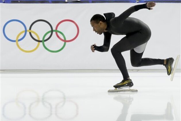 Shani Davis of the U.S. skates in the prototype of the official US Speedskating suit during a training session at the Adler Arena Skating Center at the 2014 Winter Olympics, Friday, Feb. 14, 2014, in Sochi, Russia. The team thought it had a chance to do something special, given some impressive World Cup results this season and new high-tech suits from Under Armour, which got an assist in the design from aerospace giant Lockheed Martin. Now, there's plenty of grumbling that the suits are actually slowing the skaters down in Sochi. (AP Photo/Matt Dunham)