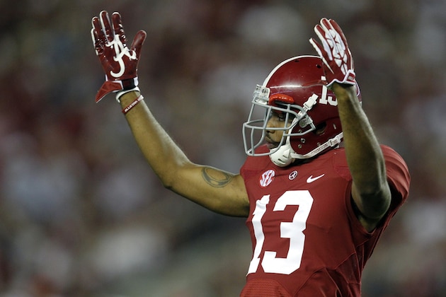 Alabama defensive back Deion Belue (13) tries to get the crowd to cheer louder during the second half of an NCAA college football game against Mississippi on Saturday, Sept. 28, 2013, in Tuscaloosa, Ala. (AP Photo/Butch Dill)