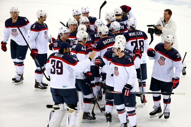 SOCHI, RUSSIA - FEBRUARY 13:  The United States celebrate winning 7-1 against Slovakia during the Men's Ice Hockey Preliminary Round Group A game on day six of the Sochi 2014 Winter Olympics at Shayba Arena on February 13, 2014 in Sochi, Russia.  (Photo by Streeter Lecka/Getty Images)