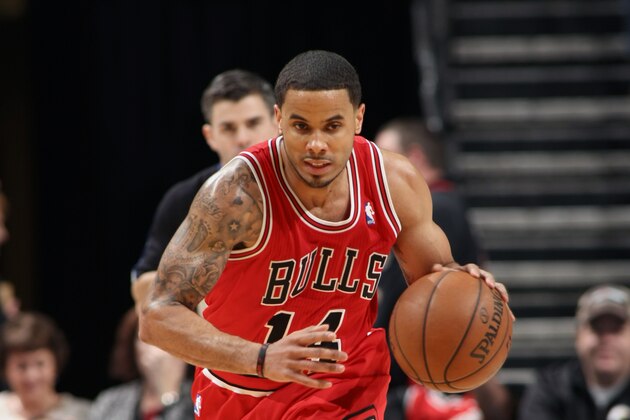 CHARLOTTE, NC - JANUARY 25:  D.J. Augustin #14 of the Chicago Bulls handles the ball against the Charlotte Bobcats at the Time Warner Cable Arena on January 25, 2014 in Charlotte, North Carolina. NOTE TO USER: User expressly acknowledges and agrees that, by downloading and or using this photograph, User is consenting to the terms and conditions of the Getty Images License Agreement.  Mandatory Copyright Notice:  Copyright 2014 NBAE (Photo by Brock Williams-Smith/NBAE via Getty Images)