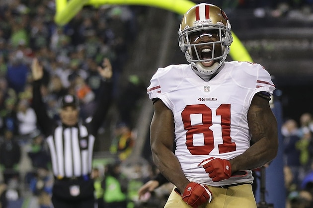 San Francisco 49ers' Anquan Boldin celebrates his touchdown catch during the second half of the NFL football NFC Championship game against the Seattle Seahawks Sunday, Jan. 19, 2014, in Seattle. (AP Photo/Marcio Jose Sanchez)