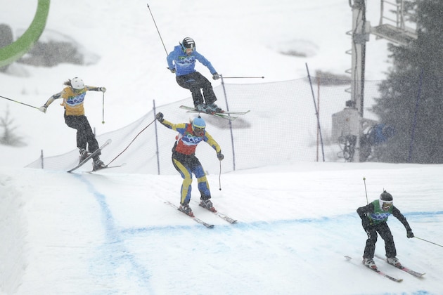Anna Holmlund of Sweden, 2nd center Sasa Faric of Slovenia, top, Katya Crema of Australia,left and Karin Huttary of Austria, right compete in the women's skicross quarterfinal at the Vancouver 2010 Olympics in Vancouver, British Columbia, Tuesday, Feb. 23, 2010. (AP Photo/Marcio Sanchez)