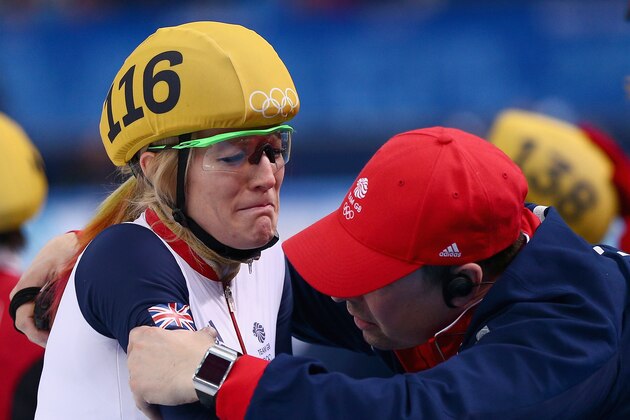 SOCHI, RUSSIA - FEBRUARY 13:  Elise Christie of Great Britain is consoled after the Short Track Speed Skating Ladies' 500 m Final on day 6 of the Sochi 2014 Winter Olympics at at Iceberg Skating Palace on February 13, 2014 in Sochi, Russia.  (Photo by Clive Mason/Getty Images)