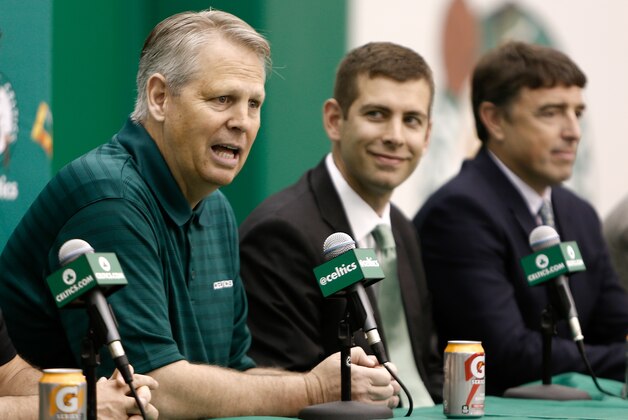 Jul 5, 2013; Waltham, MA, USA; General Manager Danny Ainge talks about hiring new Boston Celtics head coach Brad Stevens, center, as owner Wyc Grousbeck, right, listens in during a news conference announcing Stevens new position. Mandatory Credit: Winslow Townson-USA TODAY Sports