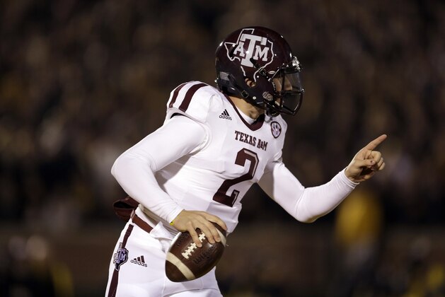 Texas A&M quarterback Johnny Manziel scrambles during the first half of an NCAA college football game against Missouri on Saturday, Nov. 30, 2013, in Columbia, Mo. (AP Photo/Jeff Roberson)