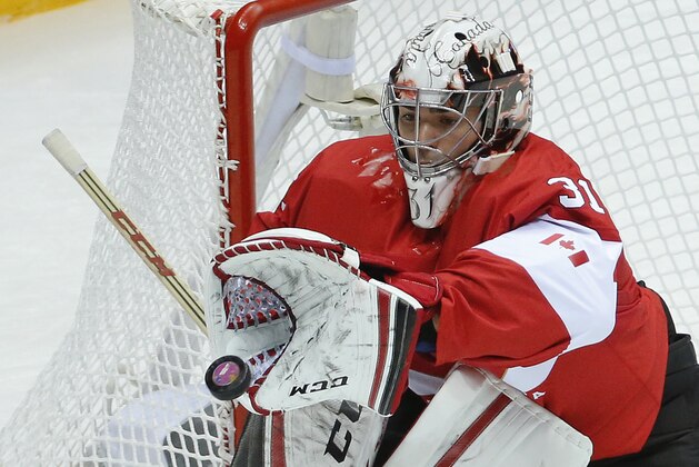 Canada goaltender Carey Price stops a shot on goal by Norway in the first period of a men's ice hockey game at the 2014 Winter Olympics, Thursday, Feb. 13, 2014, in Sochi, Russia. (AP Photo/Mark Humphrey)