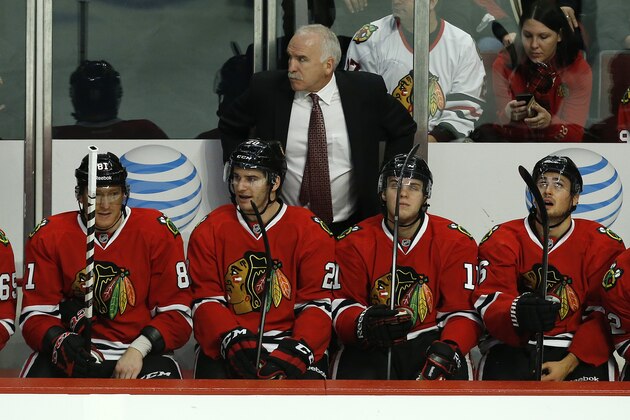 Chicago Blackhawks head coach Joel Quenneville during the third period of an NHL hockey game against the Florida Panthers on Sunday, Dec. 8, 2013, in Chicago, Ill. (AP Photo/Andrew A. Nelles)
