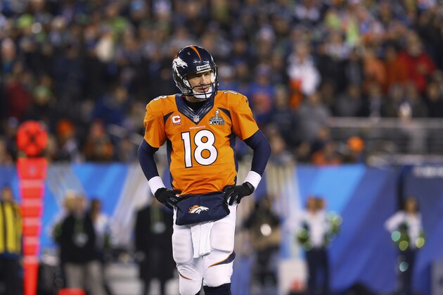 Denver Broncos quarterback Peyton Manning (18) watches against the Seattle Seahawks  during the NFL Super Bowl XLVIII football game at MetLife Stadium Sunday, Feb. 2, 2014, in East Rutherford, N.J. The Seahawks won 43-8. (AP Photo/Paul Sancya)