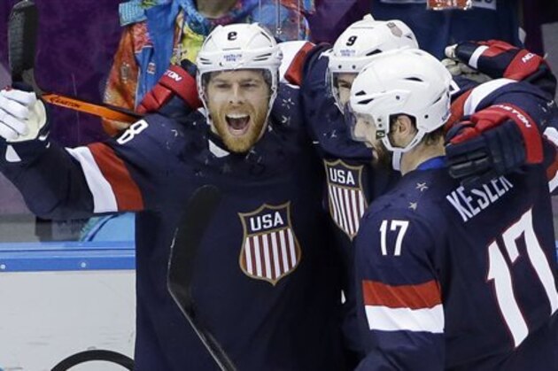 USA forward Joe Pavelski reacts with teammates after scoring a goal against Russia in the third period of a men's ice hockey game at the 2014 Winter Olympics, Saturday, Feb. 15, 2014, in Sochi, Russia. (AP Photo/David J. Phillip ) USA forward Joe Pavelski reacts with teammates after scoring a goal against Russia in the third period of a men's ice hockey game at the 2014 Winter Olympics, Saturday, Feb. 15, 2014, in Sochi, Russia. (AP Photo/David J. Phillip )