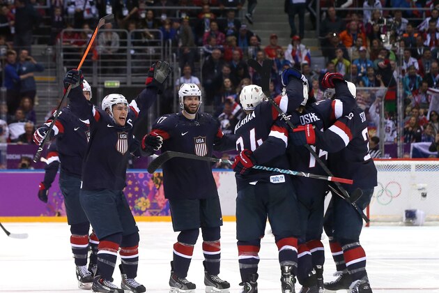 SOCHI, RUSSIA - FEBRUARY 15:  T.J. Oshie #74 of the United States celebrates with teammates Ryan Callahan #24, Paul Stastny #26, Ryan Kesler #17 and Zach Parise #9 after scoring on a shootout against Sergei Bobrovski #72 of Russia to win the Men's Ice Hockey Preliminary Round Group A game on day eight of the Sochi 2014 Winter Olympics at Bolshoy Ice Dome on February 15, 2014 in Sochi, Russia.  (Photo by Bruce Bennett/Getty Images)