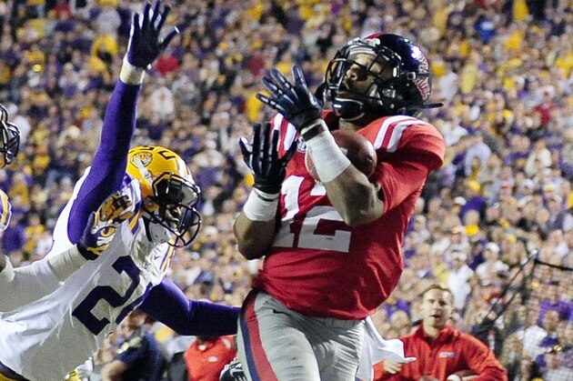 BATON ROUGE, LA - NOVEMBER 17:  Donte Moncrief #12 of the Ole Miss Rebels catches a touchdown pass over Jalen Mills #28 and Tharold Simon #24 of the LSU Tigers during a game at Tiger Stadium on November 17, 2012 in Baton Rouge, Louisiana.  (Photo by Stacy Revere/Getty Images)