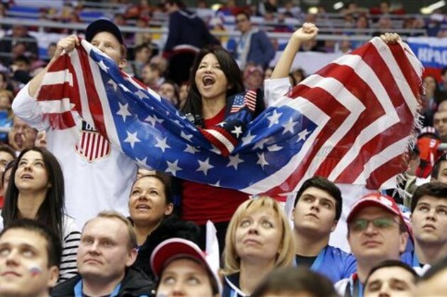 US fans cheer a second period goal by the USA against Russia during a men's ice hockey game at the 2014 Winter Olympics, Saturday, Feb. 15, 2014, in Sochi, Russia. (AP Photo/Mark Humphrey)