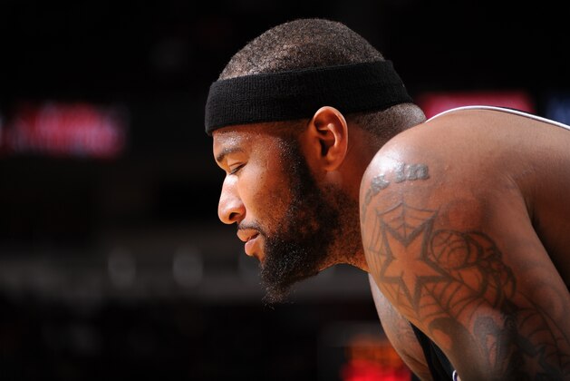 HOUSTON, TX - JANUARY 22:  DeMarcus Cousins #15 of the Sacramento Kings reacts to a play against the Houston Rockets on January 22, 2014 at the Toyota Center in Houston, Texas. NOTE TO USER: User expressly acknowledges and agrees that, by downloading and or using this photograph, User is consenting to the terms and conditions of the Getty Images License Agreement. Mandatory Copyright Notice: Copyright 2014 NBAE (Photo by Bill Baptist/NBAE via Getty Images)