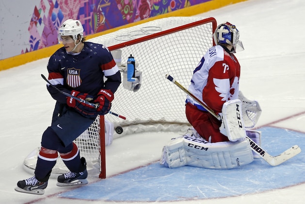 USA forward T.J. Oshie scores a goal in a shootout against Russia during a men's ice hockey game at the 2014 Winter Olympics, Saturday, Feb. 15, 2014, in Sochi, Russia. (AP Photo/Petr David Josek)