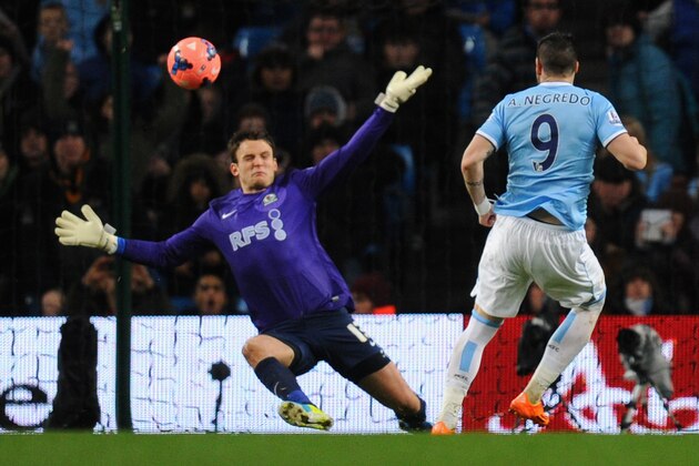 MANCHESTER, ENGLAND - JANUARY 15:  Alvaro Negredo of Manchester City scores the second goal past Simon Eastwood of Blackburn Rovers during the Budweiser FA Cup Third Round Replay match between Manchester City and Blackburn Rovers at the Etihad Stadium on January 15, 2014 in Manchester, England.  (Photo by Stu Forster/Getty Images)