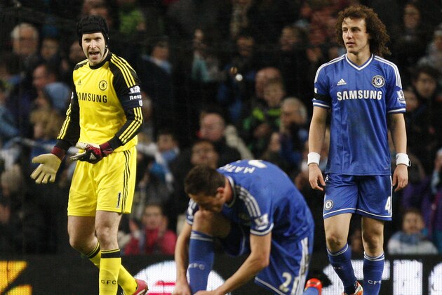 Chelsea's goalkeeper Petr Cech, left shouts out as his side concede a second goal during their English FA Cup fifth round soccer match against manchester City at the Etihad Stadium, Manchester, England, Saturday, Feb. 15, 2014. (AP Photo/Jon Super)