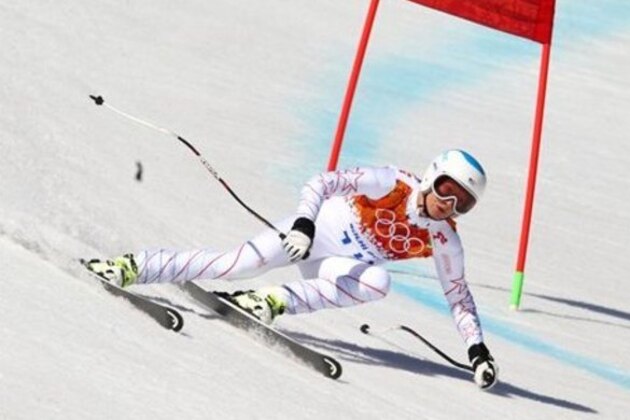 United States' Julia Mancuso makes a turn in the women's super-G at the Sochi 2014 Winter Olympics, Saturday, Feb. 15, 2014, in Krasnaya Polyana, Russia.(AP Photo/Alessandro Trovati)
