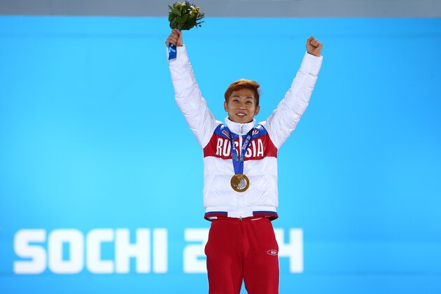 SOCHI, RUSSIA - FEBRUARY 15:  Gold medalist Victor An of Russia celebrates on the podium during the medal ceremony for the Short Track Speed Skating Men's on day 8 of the Sochi 2014 Winter Olympics at Medals Plaza on February 15, 2014 in Sochi, Russia.  (Photo by Streeter Lecka/Getty Images)