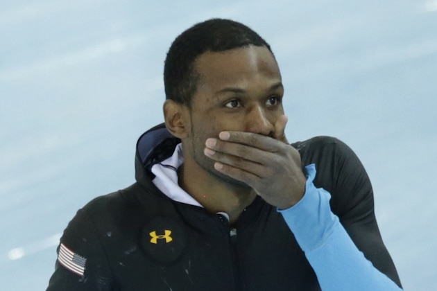 Shani Davis of the U.S. covers his mouth after  competing in the men's 1,500-meter speedskating race at the Adler Arena Skating Center during the 2014 Winter Olympics in Sochi, Russia, Saturday, Feb. 15, 2014. (AP Photo/Matt Dunham)