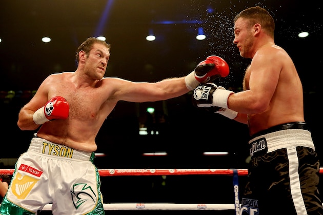 LONDON, ENGLAND - FEBRUARY 15:  Tyson Fury of Great Britain (L) in action with Joey Abell of USA during their International Heavyweight bout at The Copper Box on February 15, 2014 in London, England.  (Photo by Scott Heavey/Getty Images)