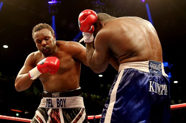 LONDON, ENGLAND - FEBRUARY 15:  Dereck Chisora of Great Britain in action with Kevin Johnson of USA during their WBO and WBA International Heavyweight Championship bout at The Copper Box on February 15, 2014 in London, England.  (Photo by Scott Heavey/Getty Images)