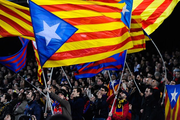 BARCELONA, SPAIN - DECEMBER 14:  FC Barcelona supporters wave pro-independence Catalan flags during the La Liga match between FC Barcelona and Villarreal CF at Camp Nou on December 14, 2013 in Barcelona, Spain.  (Photo by David Ramos/Getty Images)