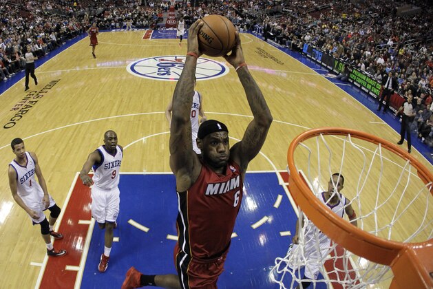 Miami Heat's LeBron James goes up for a dunk during the first half of an NBA basketball game against the Philadelphia 76ers, Friday, Jan. 17, 2014, in Philadelphia. (AP Photo/Matt Slocum)