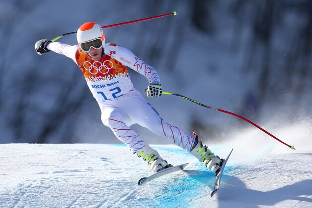 United States' Bode Miller makes a turn in a men's downhill training run for the Sochi  2014 Winter Olympics, Friday, Feb. 7, 2014, in Krasnaya Polyana, Russia. (AP Photo/Alessandro Trovati)