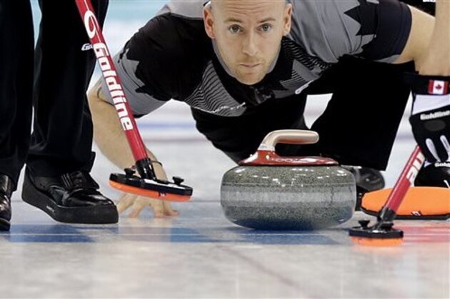 Canada's Ryan Fry releases the rock during the men's curling competition against Britain at the 2014 Winter Olympics, Saturday, Feb. 15, 2014, in Sochi, Russia. (AP Photo/Wong Maye-E)
