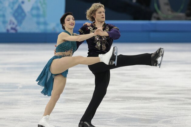 Meryl Davis and Charlie White of the United States compete in the team free ice dance figure skating competition at the Iceberg Skating Palace during 2014 Winter Olympics, Sunday, Feb. 9, 2014, in Sochi, Russia. (AP Photo/Ivan Sekretarev) Meryl Davis and Charlie White of the United States compete in the team free ice dance figure skating competition at the Iceberg Skating Palace during 2014 Winter Olympics, Sunday, Feb. 9, 2014, in Sochi, Russia. (AP Photo/Ivan Sekretarev)