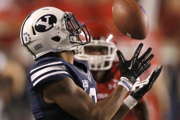 SALT LAKE CITY, UT - SEPTEMBER 15: Cody Hoffman #2  the BYU Cougars hauls in a pass to extend a late drive as the University of Utah Utes during the second half of an college football game September 15, 2012 at Rice Eccles Stadium in Salt Lake City, Utah. Utah beat BYU 24-21. (Photo by George Frey/Getty Images)