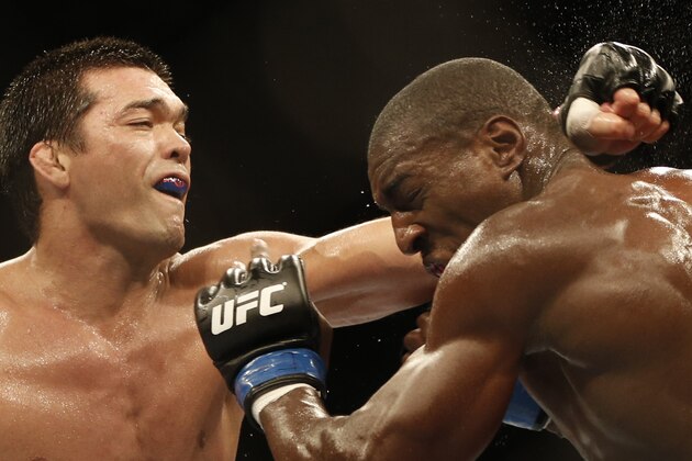 Lyoto Machida, from Brazil, left, and Phil Davis, from the U.S., battle during their UFC 163 mixed martial arts Light Heavyweight bout in Rio de Janeiro, Brazil, Sunday, Aug. 4, 2013. (AP Photo/Felipe Dana)