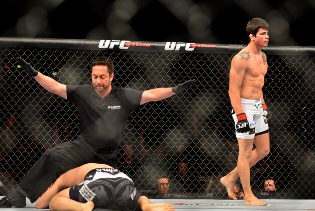 Feb 15, 2014; Jaragua do Sul, SC, Brazil; Erick Silva (red gloves) after defeating Takenori Sato (blue gloves) during UFC Fight Night Machida vs Mousasi at Arena Jaragua. Mandatory Credit: Jason Silva-USA TODAY Sports