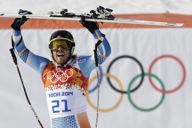 Norway's Kjetil Jansrud celebrates after his run in the men's super-G at the Sochi 2014 Winter Olympics, Sunday, Feb. 16, 2014, in Krasnaya Polyana, Russia.(AP Photo/Gero Breloer)