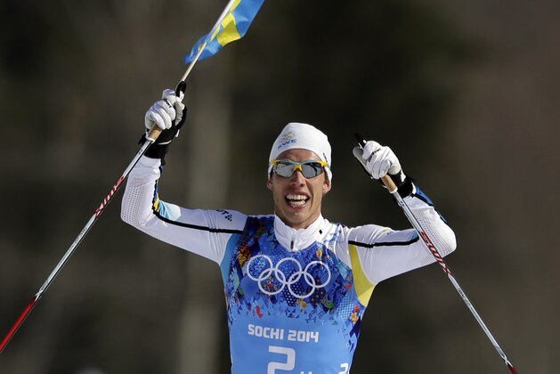 Sweden's Marcus Hellner celebrates winning the gold in the men's 4x10K cross-country relay at the 2014 Winter Olympics, Sunday, Feb. 16, 2014, in Krasnaya Polyana, Russia. (AP Photo/Felipe Dana)