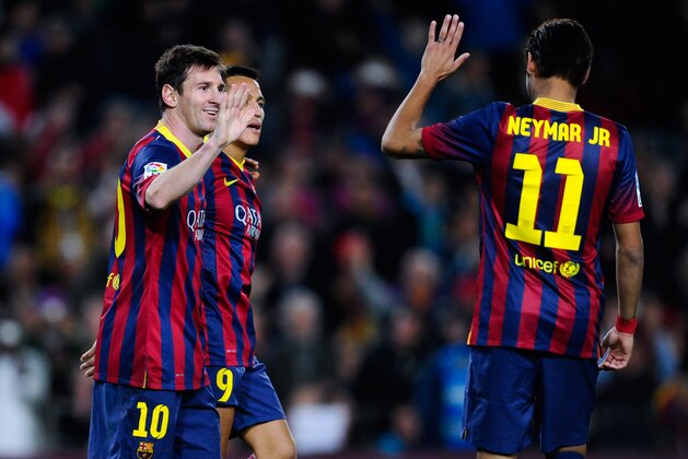 BARCELONA, SPAIN - FEBRUARY 15:  Lionel Messi of FC Barcelona celebrates with his team-mate Neymar after scoring his team's fifth goal during the La Liga match between FC Barcelona and Rayo Vallecano de Madrid at Camp Nou on February 15, 2014 in Barcelona, Spain.  (Photo by David Ramos/Getty Images)