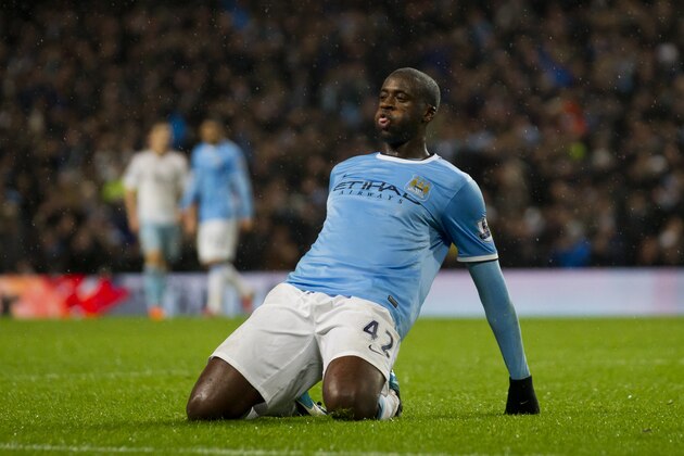 Manchester City's Yaya Toure celebrates after scoring against West Ham during their English League Cup semi-final soccer match at the Etihad Stadium, Manchester, England, Wednesday Jan. 8, 2014. (AP Photo/Jon Super)