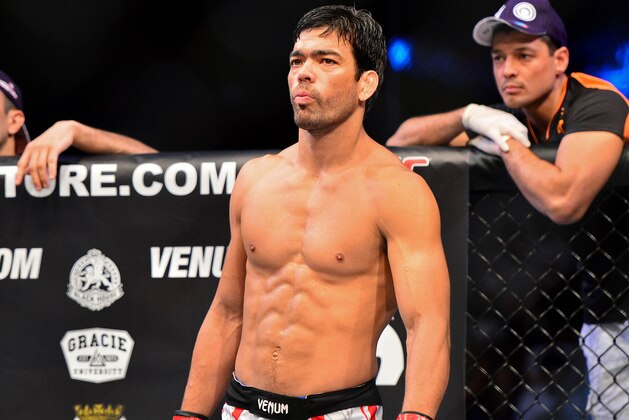 Feb 15, 2014; Jaragua do Sul, SC, Brazil; Lyoto Machida (red gloves) before his fight against Gegard Mousasi (blue gloves) during UFC Fight Night Machida vs Mousasi at Arena Jaragua. Mandatory Credit: Jason Silva-USA TODAY Sports