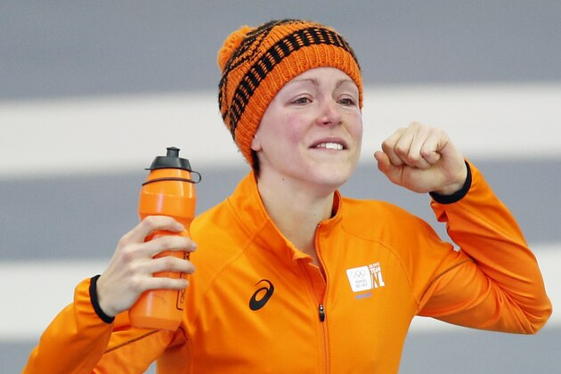 Gold medallist Jorien ter Mors of the Netherlands celebrates after the women's 1,500-meter speedskating race at the Adler Arena Skating Center during the 2014 Winter Olympics in Sochi, Russia, Sunday, Feb. 16, 2014. (AP Photo/Pavel Golovkin)