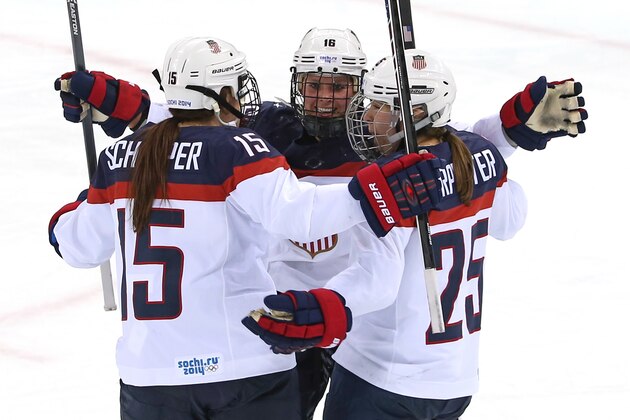 SOCHI, RUSSIA - FEBRUARY 12: Anne Schleper #15 of the United States celebrates with teammates Kelli Stack #16 and Alex Carpenter #25 after setting up Hilary Knight #21 (Not Pictured)to score a goal in the second period against Canada during the Women's Ice Hockey Preliminary Round Group A game on day five of the Sochi 2014 Winter Olympics at Shayba Arena on February 12, 2014 in Sochi, Russia.  (Photo by Bruce Bennett/Getty Images)