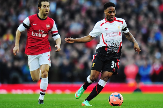 LONDON, ENGLAND - FEBRUARY 16:  Raheem Sterling (R) of Liverpool holds off the challenge of Mathieu Flamini (L) of Arsenal during the FA Cup Fifth Round match between Arsenal and Liverpool at the Emirates Stadium on February 16, 2014 in London, England.  (Photo by Shaun Botterill/Getty Images)