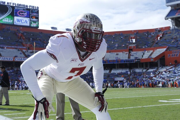 Nov 30, 2013; Gainesville, FL, USA; Florida State Seminoles linebacker Christian Jones (7) works out prior to the game against the Florida Gators at Ben Hill Griffin Stadium. Mandatory Credit: Kim Klement-USA TODAY Sports