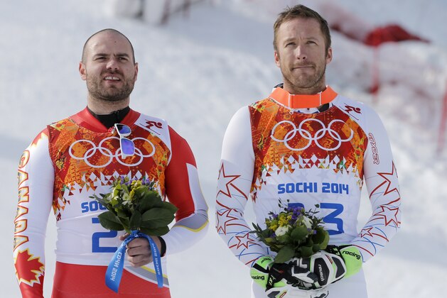 Men's super-G joint bronze medal winners Canada's Jan Hudec, left, and United States' Bode Miller stand on the podium during a flower ceremony at the Sochi 2014 Winter Olympics, Sunday, Feb. 16, 2014, in Krasnaya Polyana, Russia. (AP Photo/Christophe Ena) Men's super-G joint bronze medal winners Canada's Jan Hudec, left, and United States' Bode Miller stand on the podium during a flower ceremony at the Sochi 2014 Winter Olympics, Sunday, Feb. 16, 2014, in Krasnaya Polyana, Russia. (AP Photo/Christophe Ena)