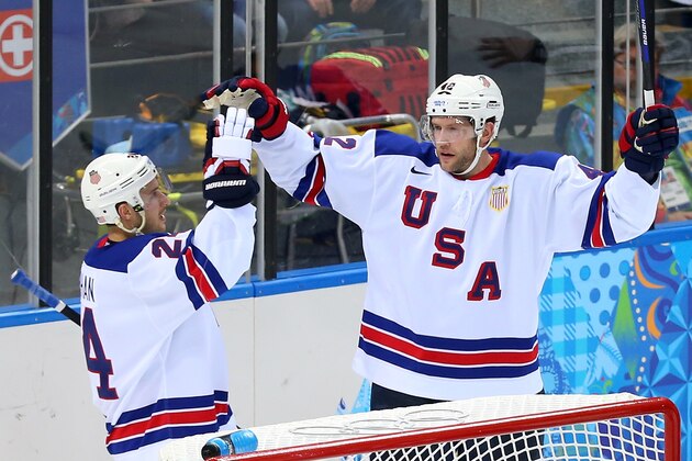 SOCHI, RUSSIA - FEBRUARY 16:  David Backes #42 of the United States celebrates after scoring a goal with Ryan Callahan #24 against Slovenia in the third period during the Men's Ice Hockey Preliminary Round Group A game on day nine of the Sochi 2014 Winter Olympics at Shayba Arena on February 16, 2014 in Sochi, Russia.  (Photo by Julian Finney/Getty Images)