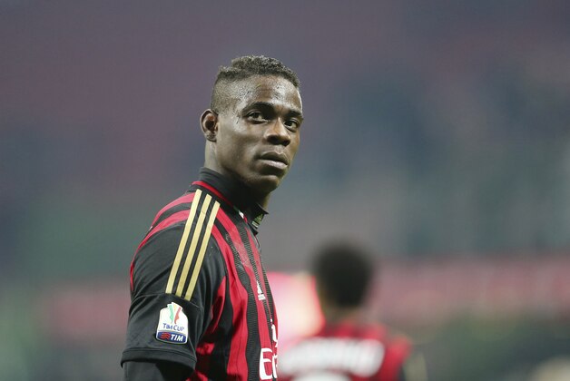 AC Milan forward Mario Balotelli stands during the Italian Cup soccer match between AC Milan and Udinese at the San Siro stadium in Milan, Italy, Wednesday, Jan. 22, 2014. (AP Photo/Antonio Calanni)