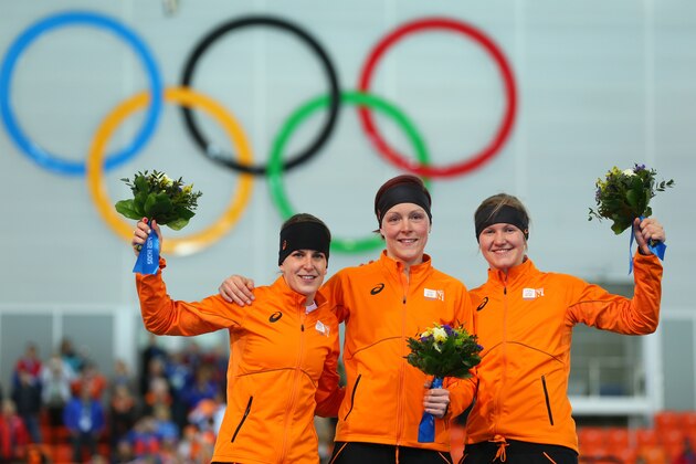 SOCHI, RUSSIA - FEBRUARY 16:  (L-R) Silver medalist Ireen Wust of the Netherlands, gold medalist Jorien ter Mors of the Netherlands and bronze medalist Lotte van Beek of the Netherlands on the podium during the flower ceremony for the Speed Skating Women's 1500m on day 9 of the Sochi 2014 Winter Olympics at Adler Arena Skating Center on February 16, 2014 in Sochi, Russia.  (Photo by Quinn Rooney/Getty Images)