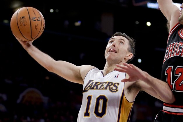 Los Angeles Lakers' Steve Nash plays against the Chicago Bulls during the first half of an NBA basketball game in Los Angeles, Sunday, Feb. 9, 2014. (AP Photo/Chris Carlson)