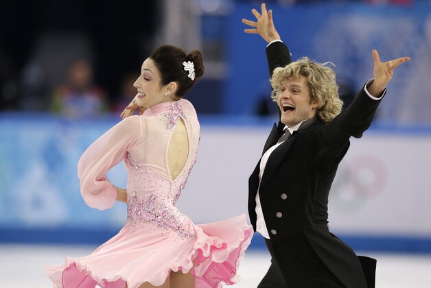 Meryl Davis and Charlie White of the United States compete in the ice dance short dance figure skating competition at the Iceberg Skating Palace during the 2014 Winter Olympics, Sunday, Feb. 16, 2014, in Sochi, Russia. (AP Photo/Darron Cummings)
